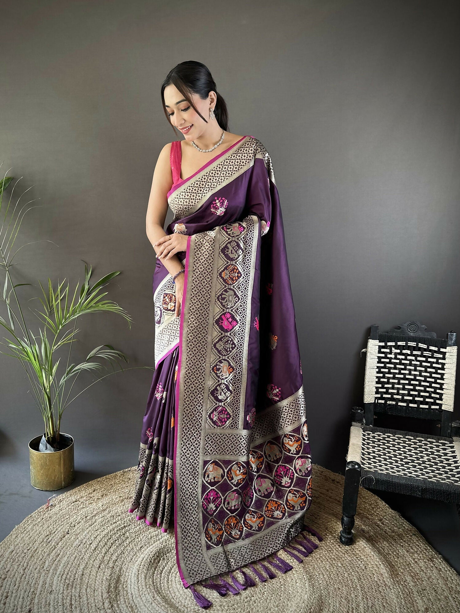 Wine colored Lichi silk Banarasi saree with intricate elephant and floral motifs