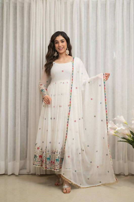 Elegant white georgette kurta set with shimmering sequence embroidery work.
