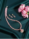 Light purple imitation cat’s eye bead necklace with a silver replica pendant.