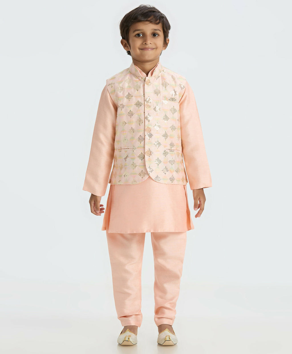 Boys' peach traditional kurta and pyjama set with matching modern Nehru jacket