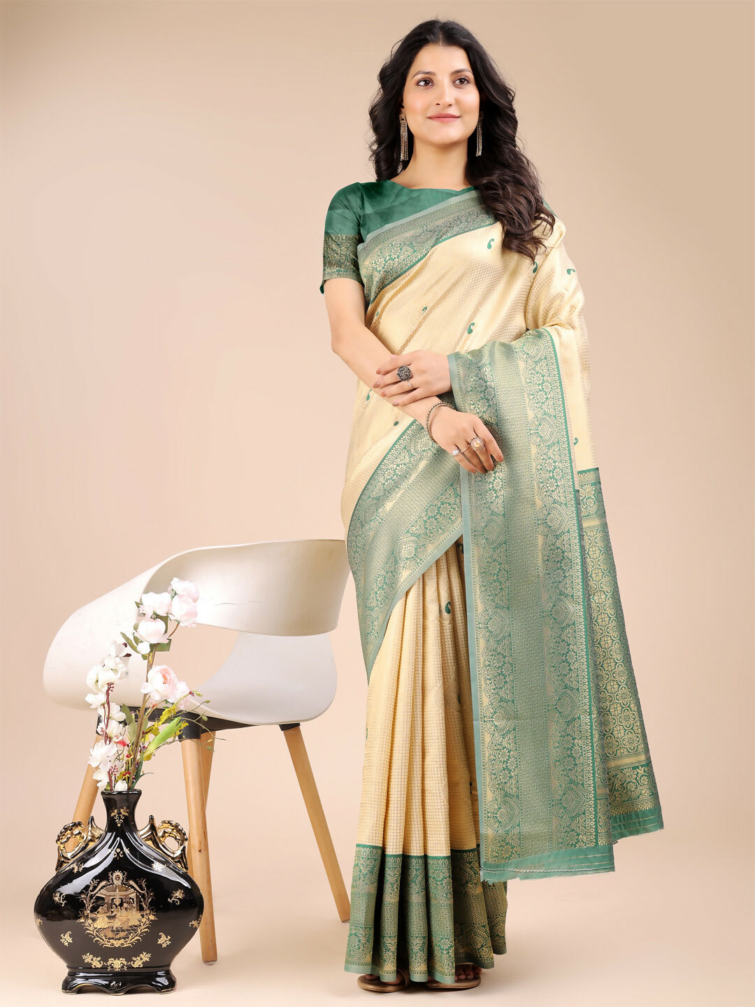 Aura Silk Cream and Green Banarasi Silk Saree with traditional rich fabric texture.