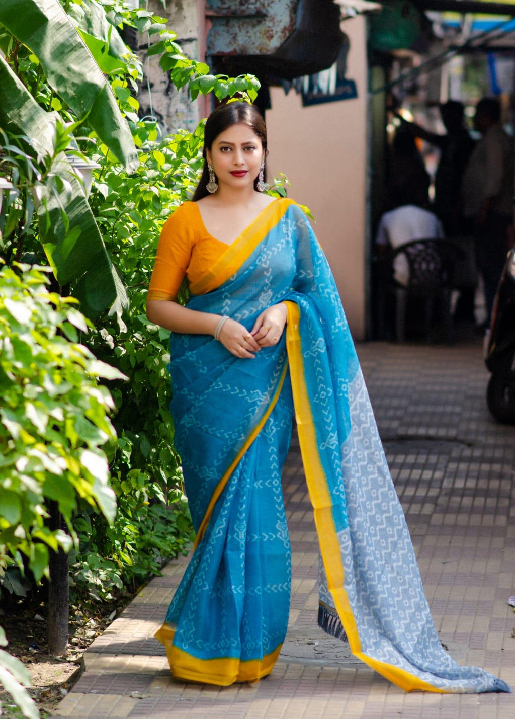Rama polycotton saree with ethnic motifs, zari pattu border, and unstitched blouse