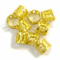 Close-up of a 12mm gold filigree hair ornament for braids and updo styling