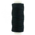 Spools of professional black and beige hair weaving thread