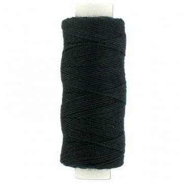 Spools of professional black and beige hair weaving thread