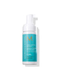A pump bottle of Moroccanoil Curl Control Mousse in signature teal and white packaging.