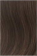A woman wearing Modern Fringe Clip-In Bangs showing a lash-skimming, natural-looking fringe.
