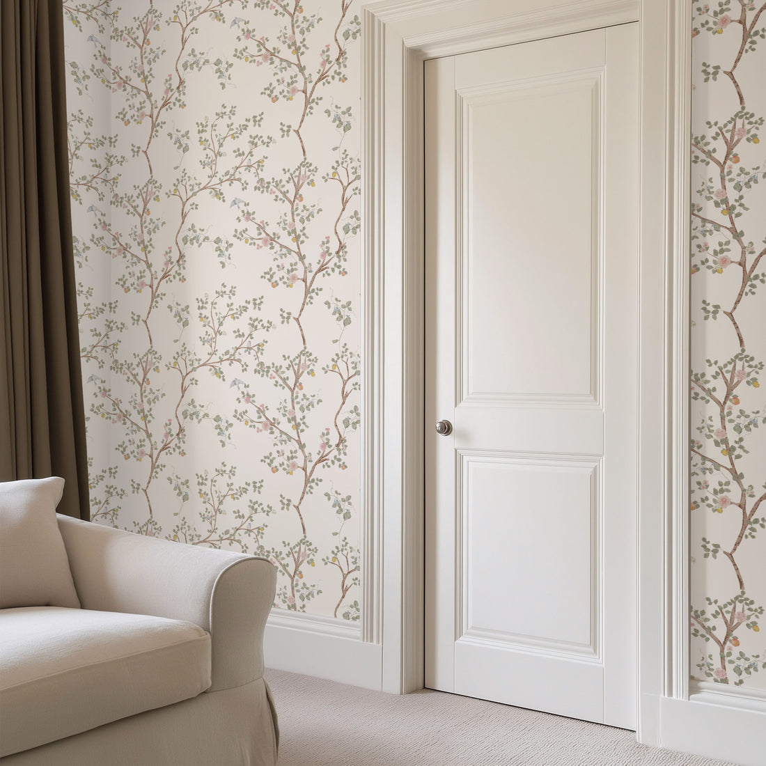 Close up of Halen wallpaper featuring sage-green and blush pink floral chinoiserie pattern on an off-white background.