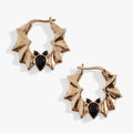 Elegant gold and silver tone hoop earrings featuring black pear-cut crystal bat motifs, gothic-glam style.
