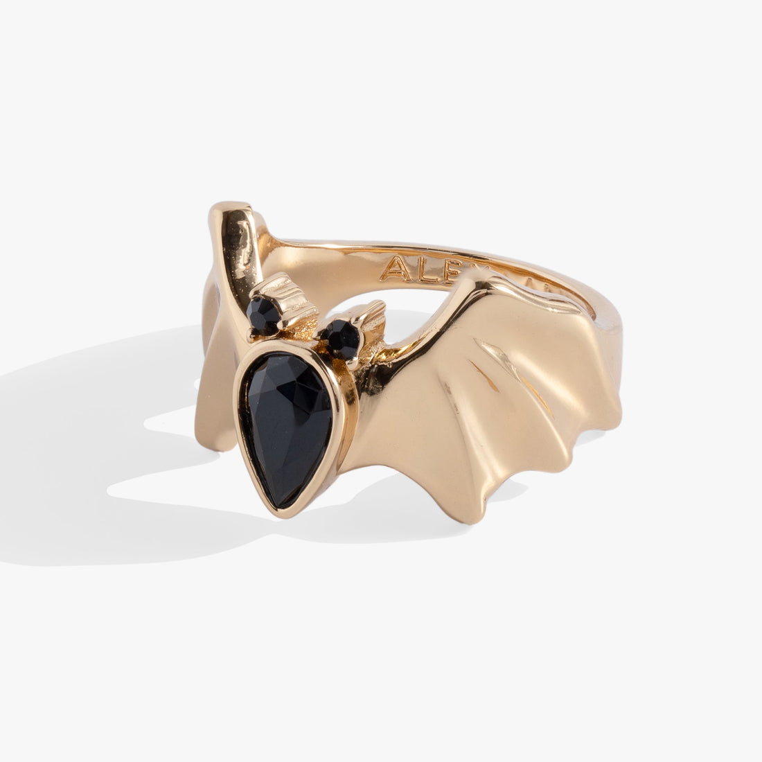 Gothic-style gold statement ring featuring a bat motif with three black teardrop-cut crystals.