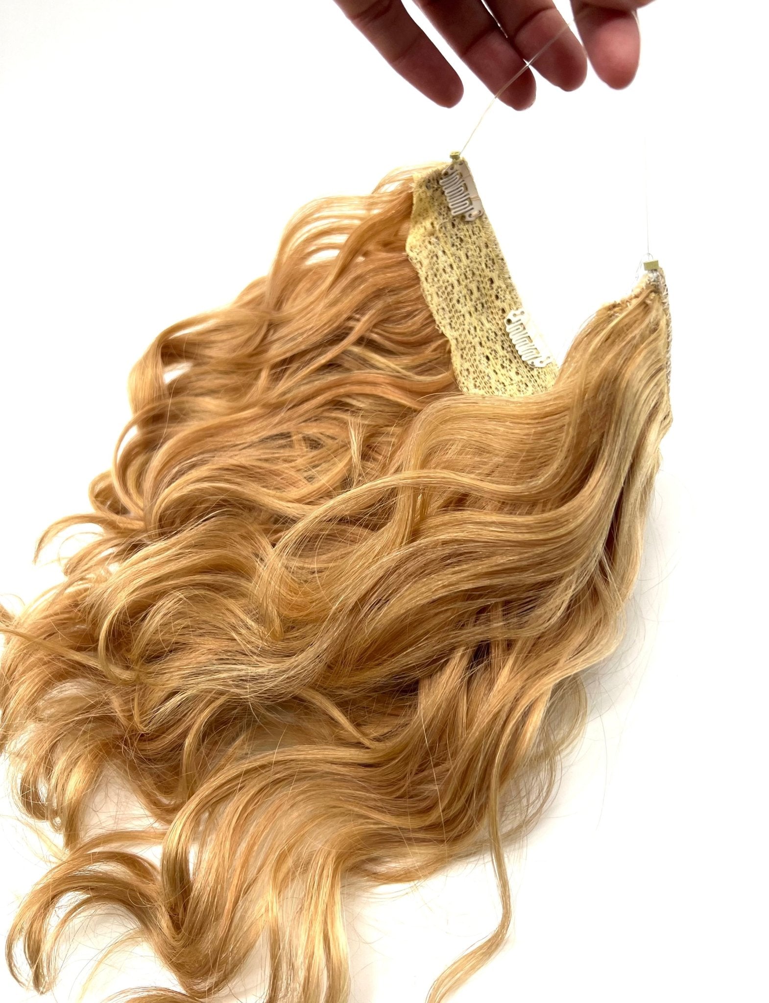 Model wearing 14-inch blonde halo hair extensions with body wave texture