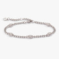 A silver curb chain bracelet featuring five crystal-accented Hamsa hand charms.