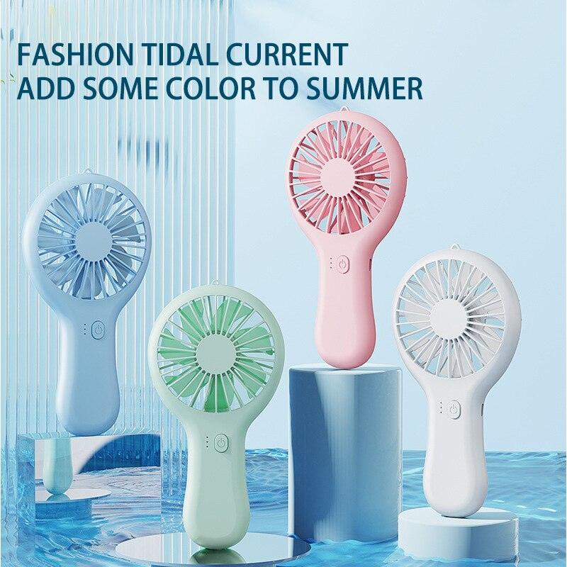 Compact handheld USB fan in soft pastel colors, suitable for office and desk use.