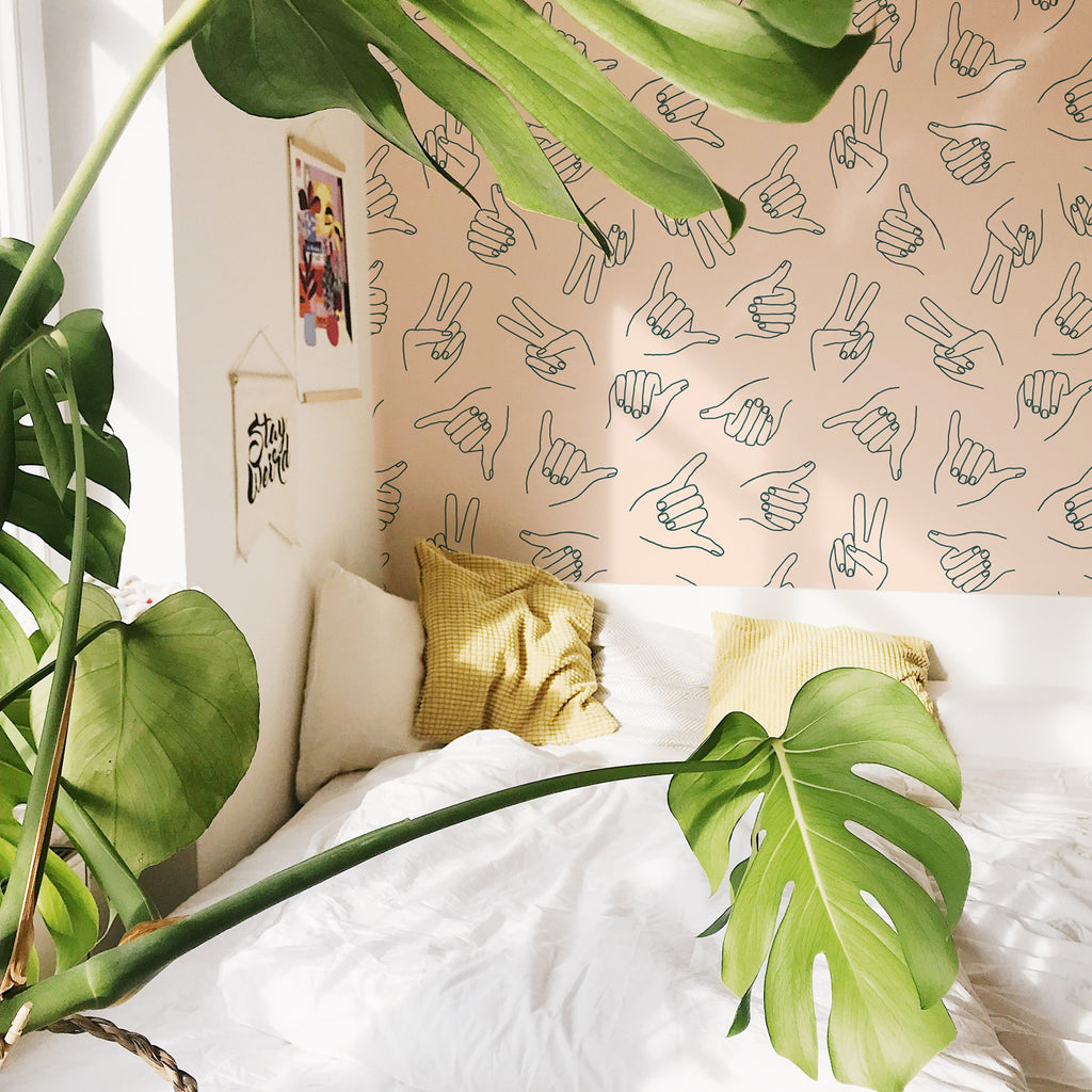 Modern bohemian wallpaper featuring peach and dark-grey abstract patterns.