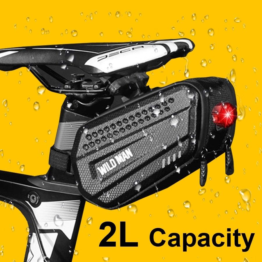 Hard shell waterproof bike seat bag with reflective strip mounted under a bicycle saddle.