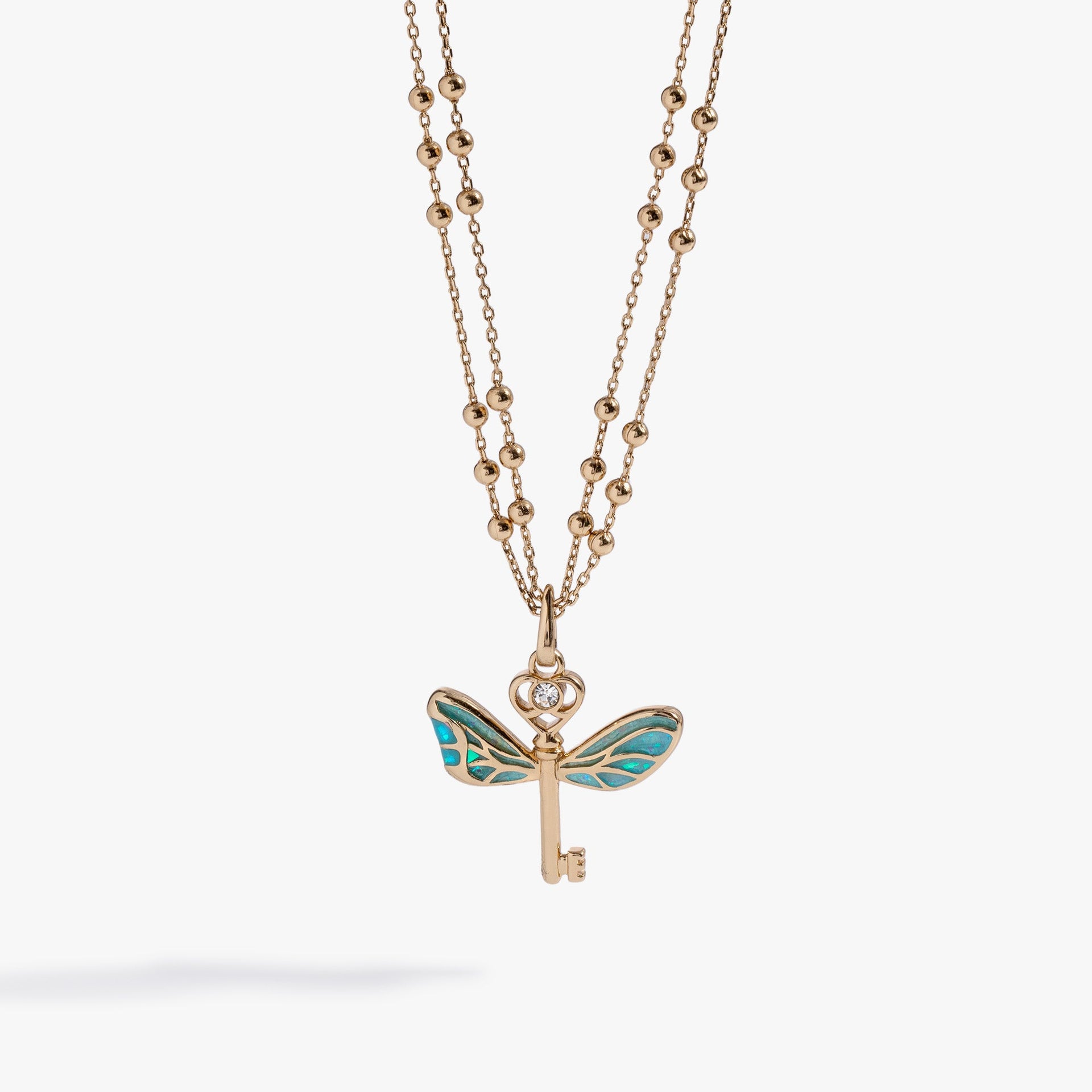 Harry Potter Flying Keys necklace in gold with teal and clear crystal accents
