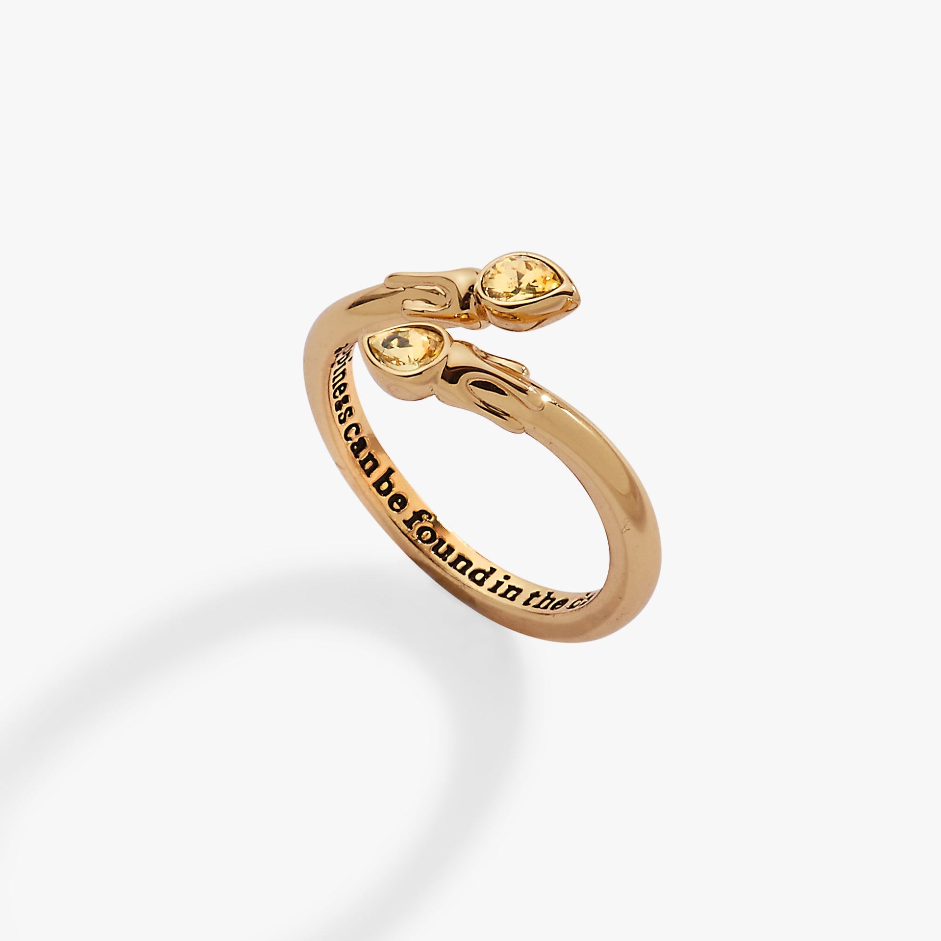Gold-plated Harry Potter bypass ring featuring flame-shaped ends with sparkling jonquil crystals.