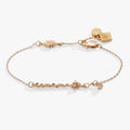 Gold-tone Harry Potter Hermione wand charm bracelet featuring a star-shaped crystal accent and adjustable chain.
