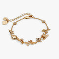 Gold-plated Harry Potter charm bracelet featuring icon charms like the Hogwarts crest and winged key