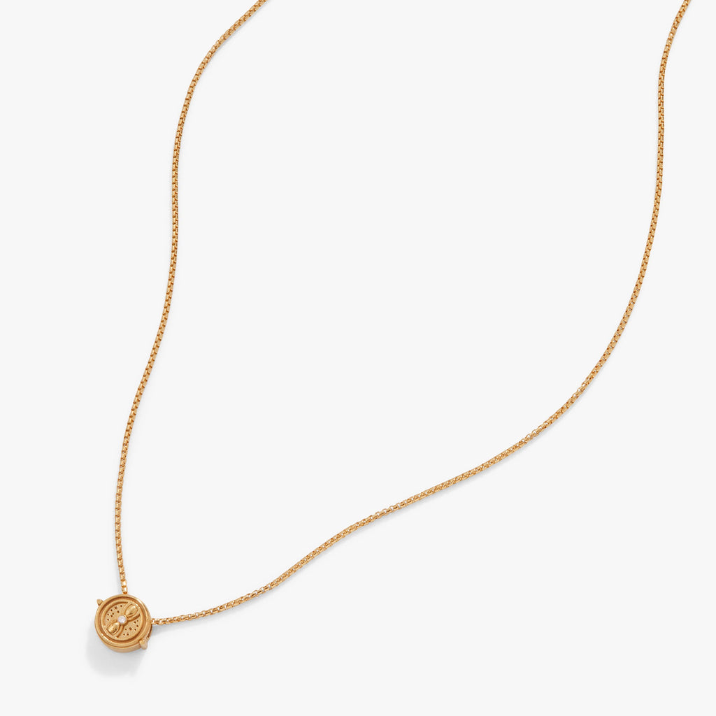 Close-up of the gold-tone Harry Potter Time Turner necklace featuring intricate rotating details.
