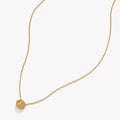 Close-up of the gold-tone Harry Potter Time Turner necklace featuring intricate rotating details.