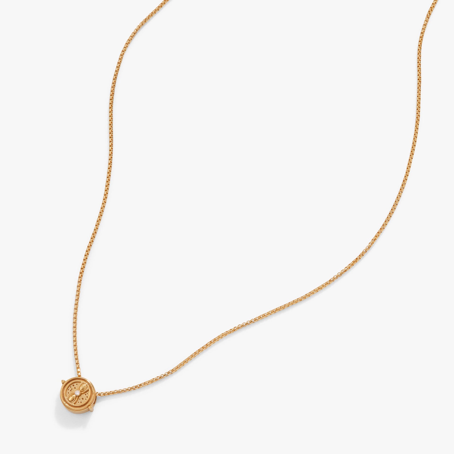 Close-up of the gold-tone Harry Potter Time Turner necklace featuring intricate rotating details.