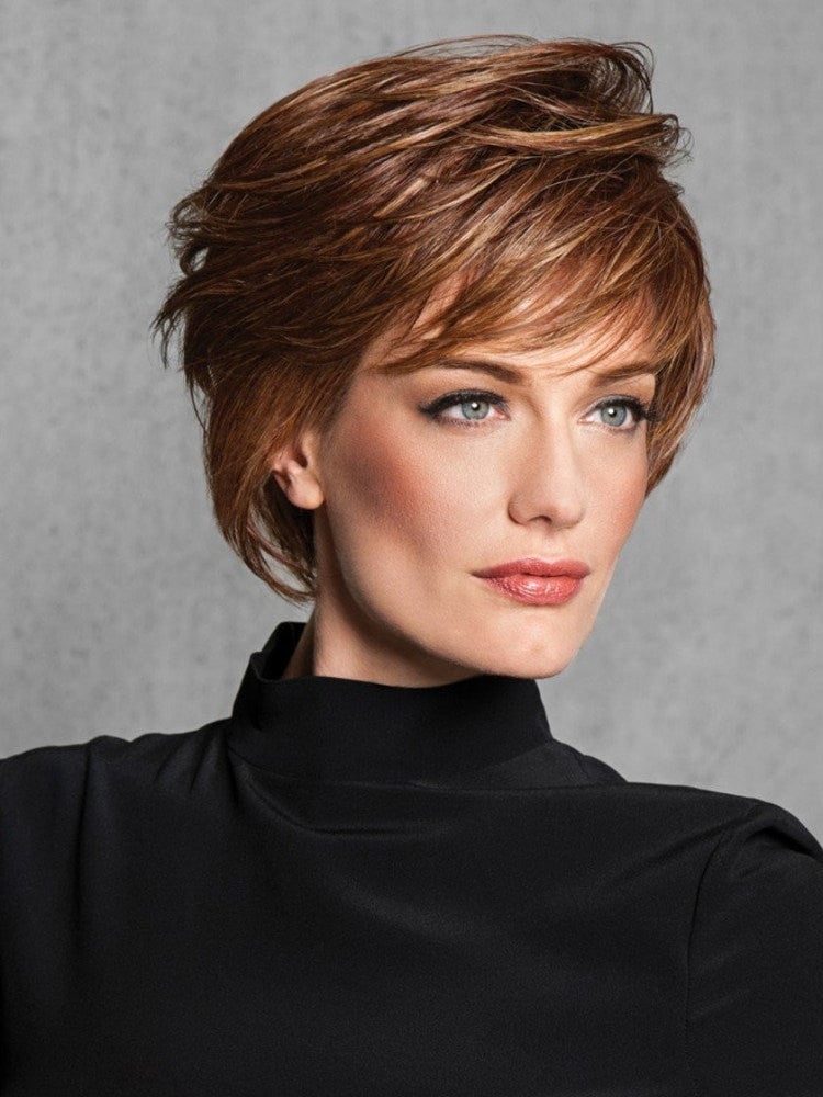 Wispy Cut synthetic wig in auburn and brown with a basic cap.