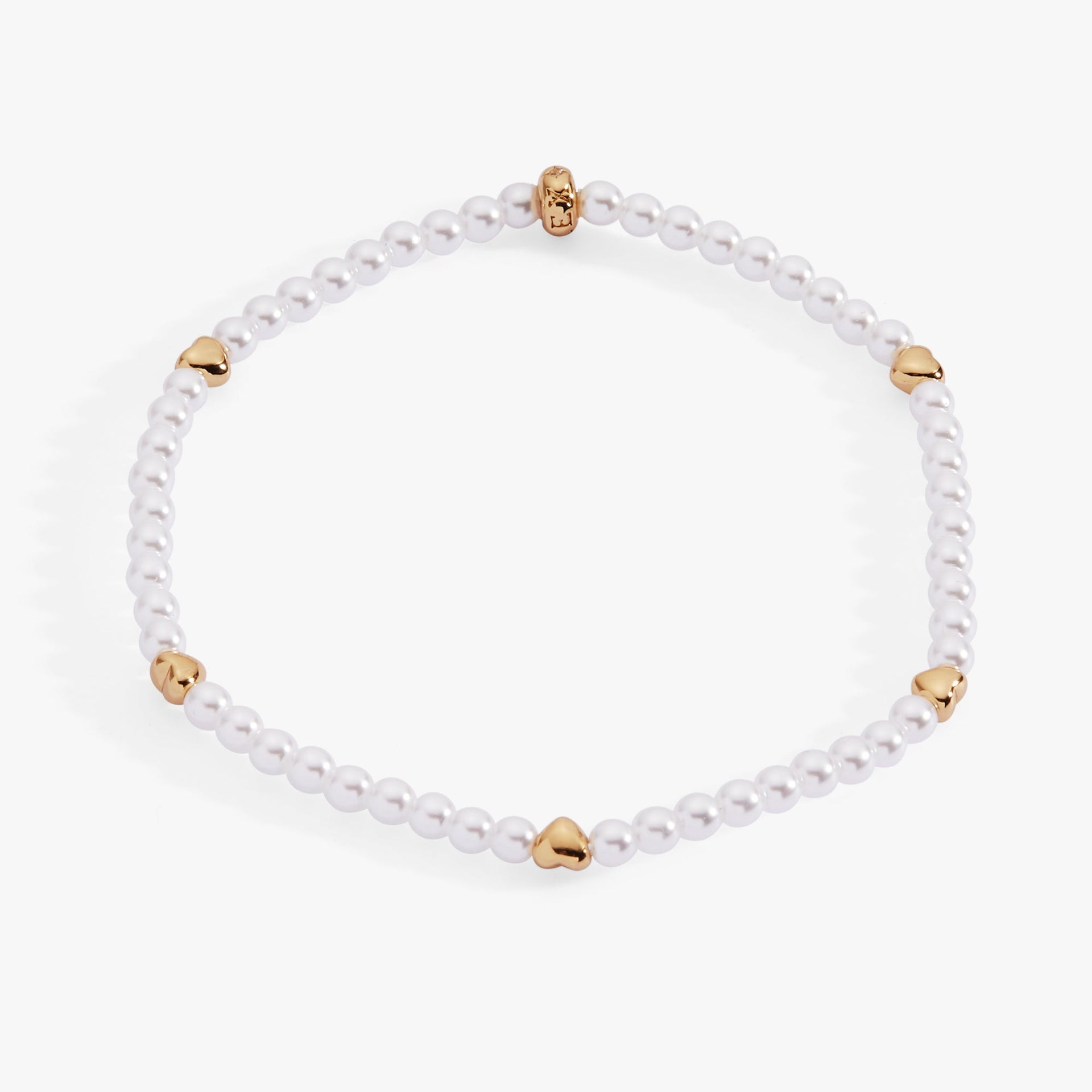 Elegant stretch bracelet featuring white faux pearls and gold-plated puffy hearts.