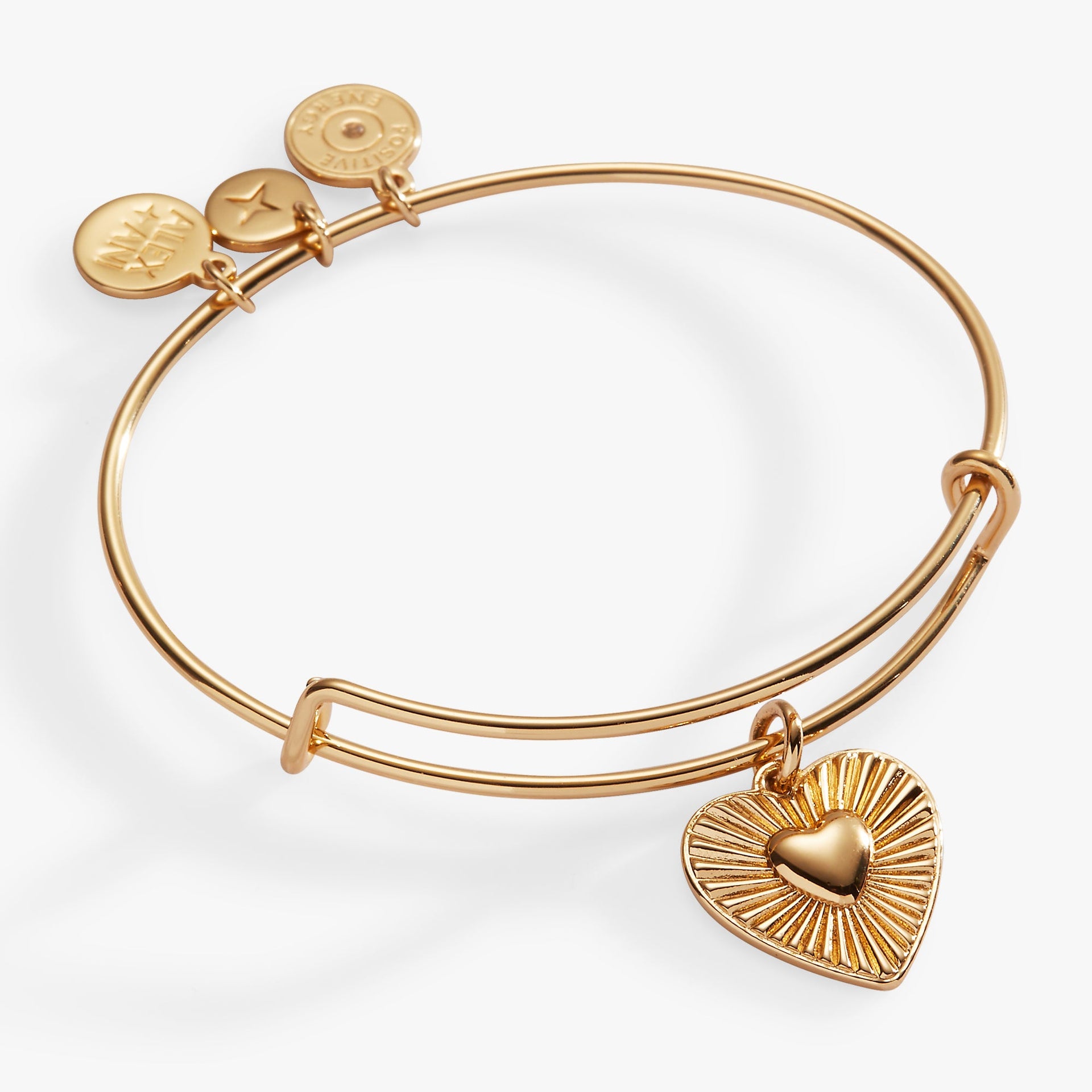 Heartburst charm expandable bangle featuring a dimensional heart charm.
