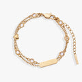 Double strand bracelet with heart symbols and crystal stones in gold and silver finishes