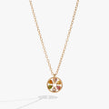 Close-up of a heart-shaped wheel necklace with colorful crystals on a delicate cable chain.