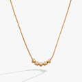 Heart slider necklace featuring five gold-plated hearts on a silky snake chain.