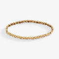 Silver-tone stainless steel tennis bracelet featuring heart charms in a delicate, adjustable design.