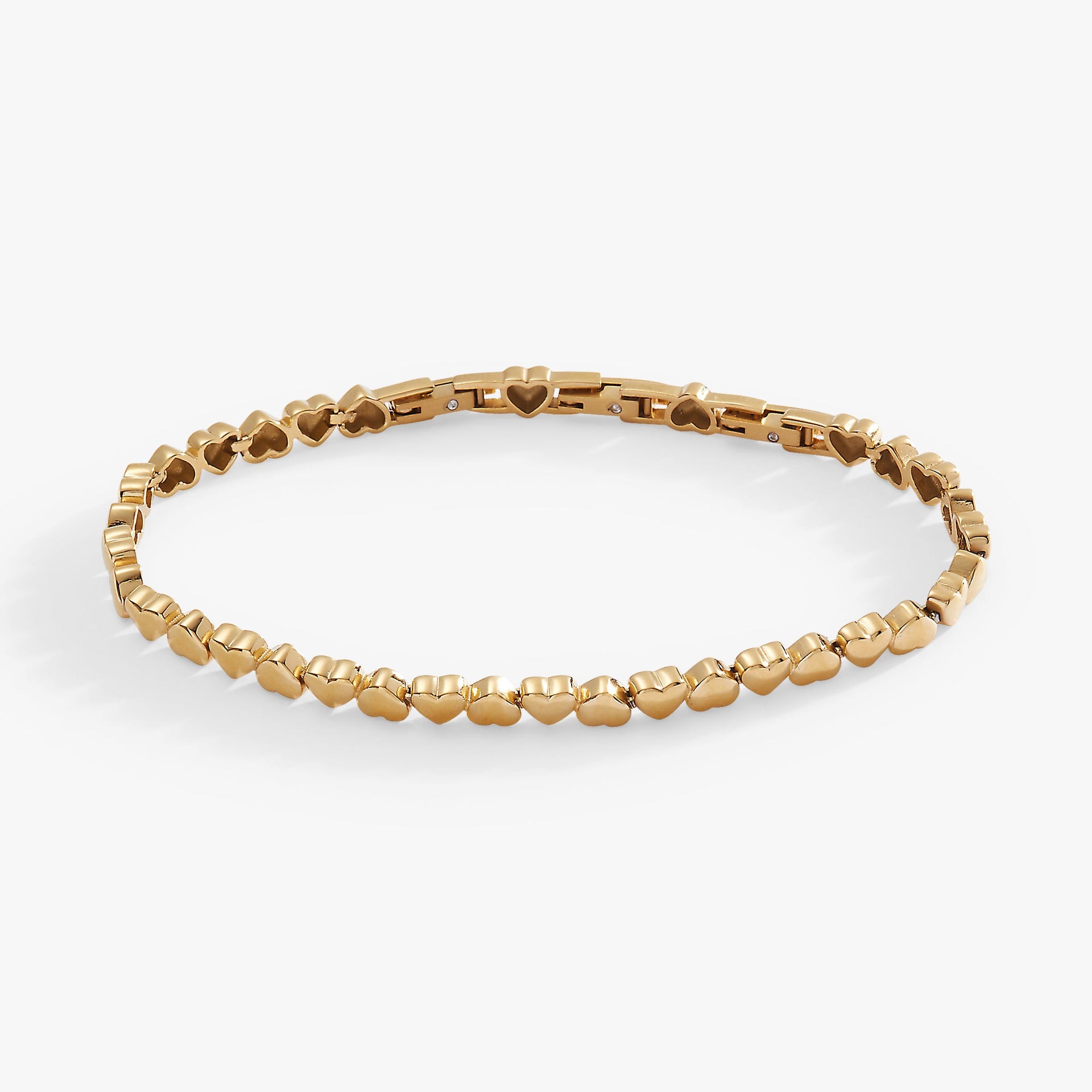 Silver-tone stainless steel tennis bracelet featuring heart charms in a delicate, adjustable design.