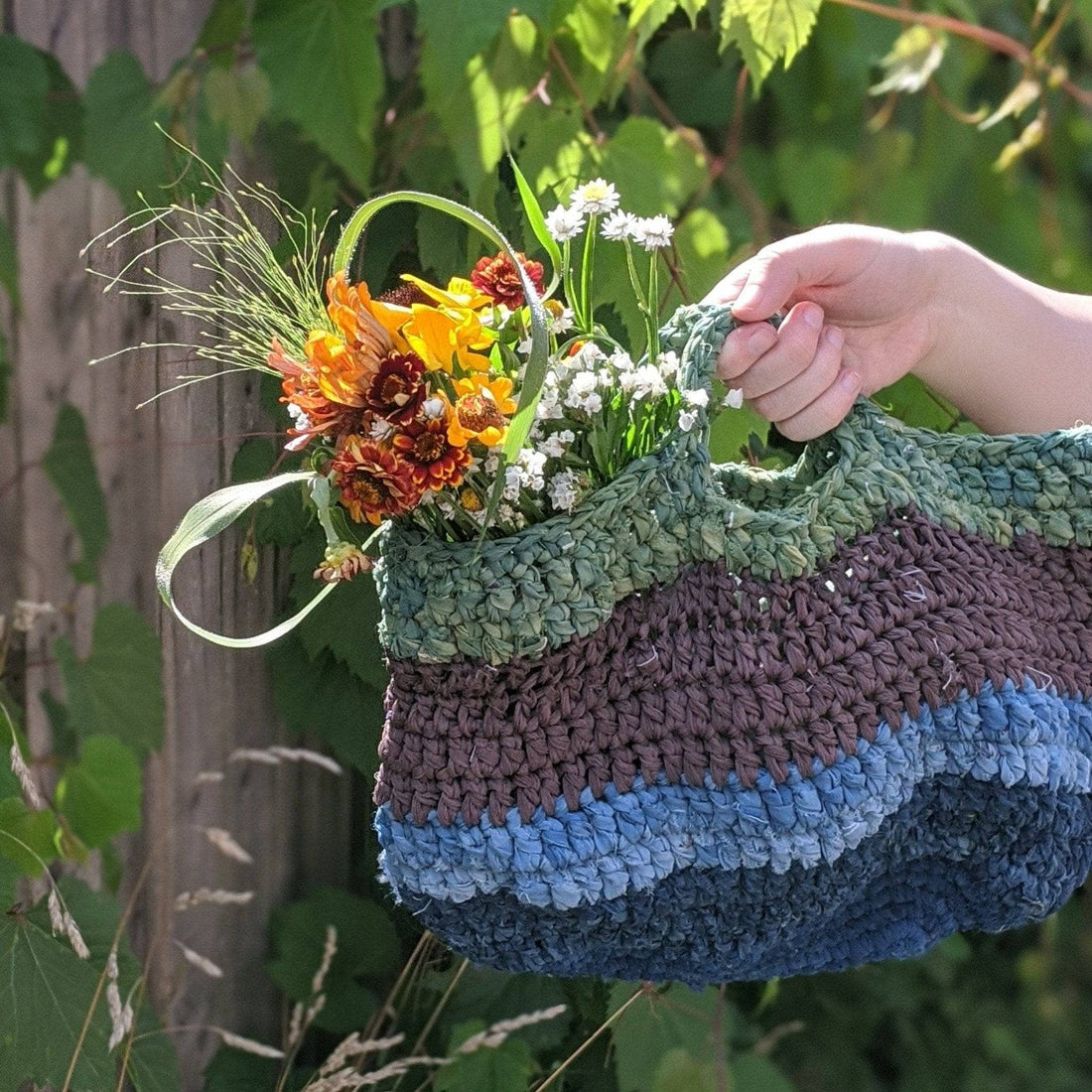 Handmade market tote bag made from colorful recycled sari silk ribbon yarn
