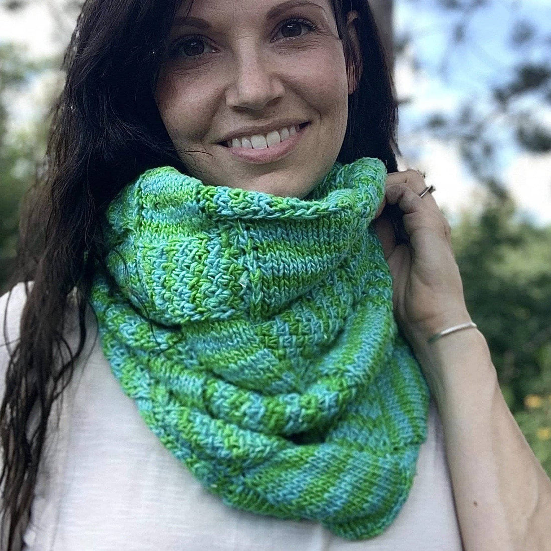 Handmade entrelac style cowl in vibrant green, blue, yellow, and pink silk roving yarn