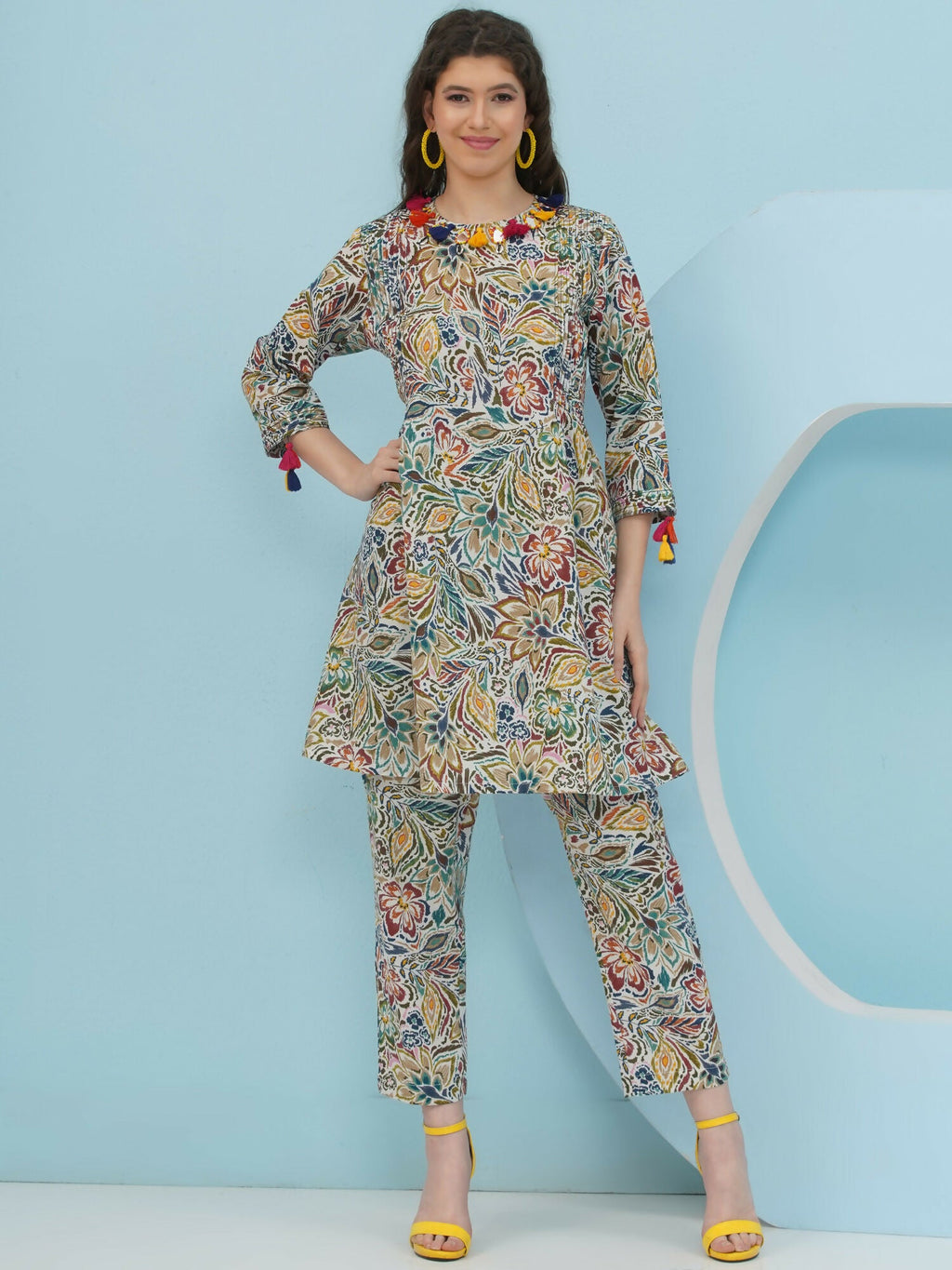 Model wearing a multi-color floral print cotton co-ord set with delicate embellishment details.