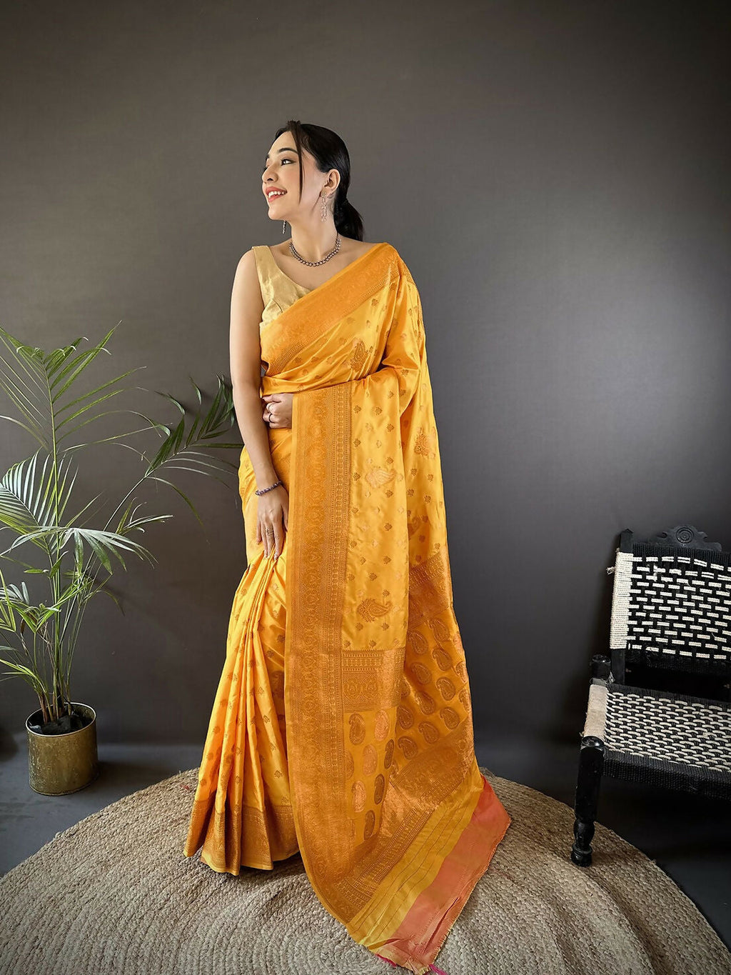 Orange Banarasi woven soft silk saree with intricate traditional patterns.