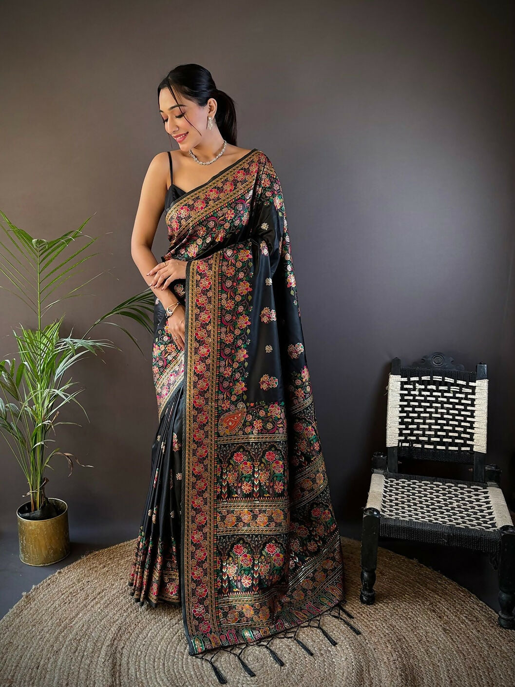 Black soft silk saree with traditional Meena weaving patterns and unstitched blouse