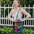 Colorful rectangular crochet Hidden Heart bag in vibrant multicolor sari silk yarn, bohemian style.