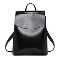 A minimalist leather backpack in solid color with anti-theft back zipper pocket.