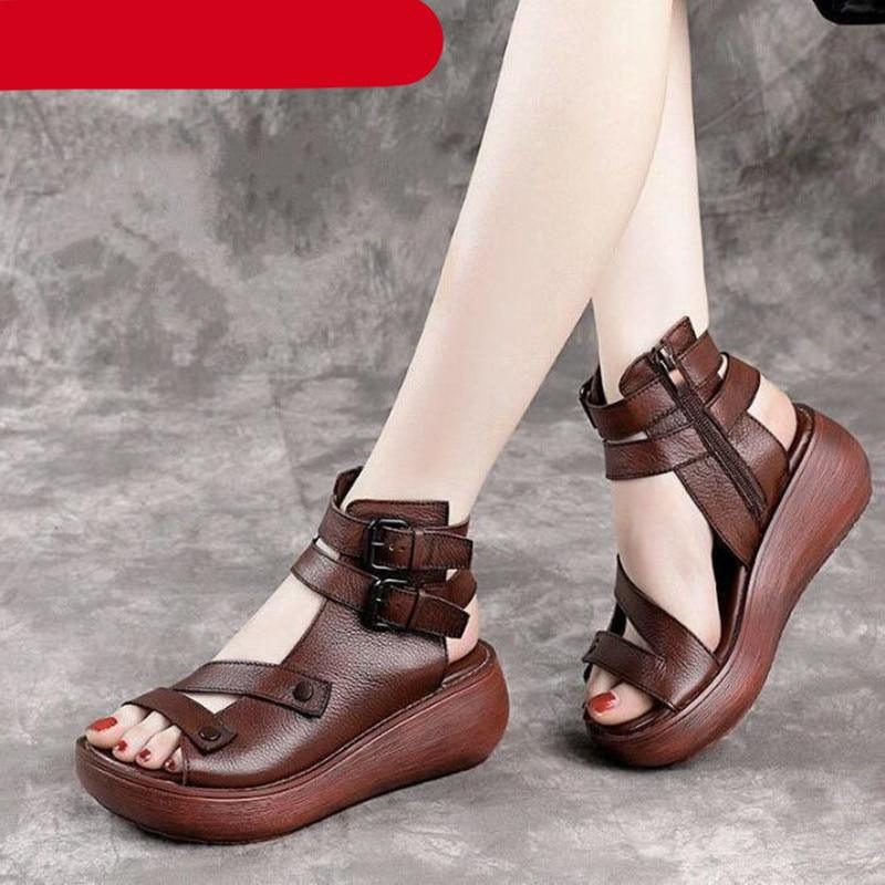 Vintage-inspired women's brown and black leather platform sandals with closed-toe design.