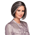 A woman wearing the High Society precision-cut wig showing a sleek and sophisticated hairstyle.