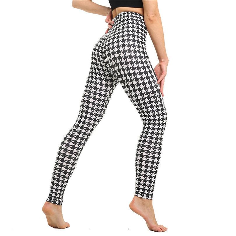 Woman wearing high waist printed fitness leggings for gym and yoga workout