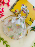 Off-white and multicolor geometric potli bag for festive fusion wear