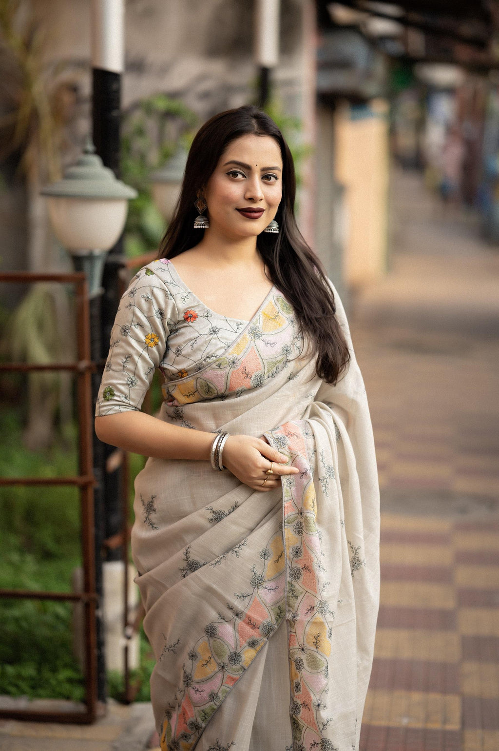 Grey pure linen saree with pencil stitch ethnic embroidery and matching phantom silk blouse