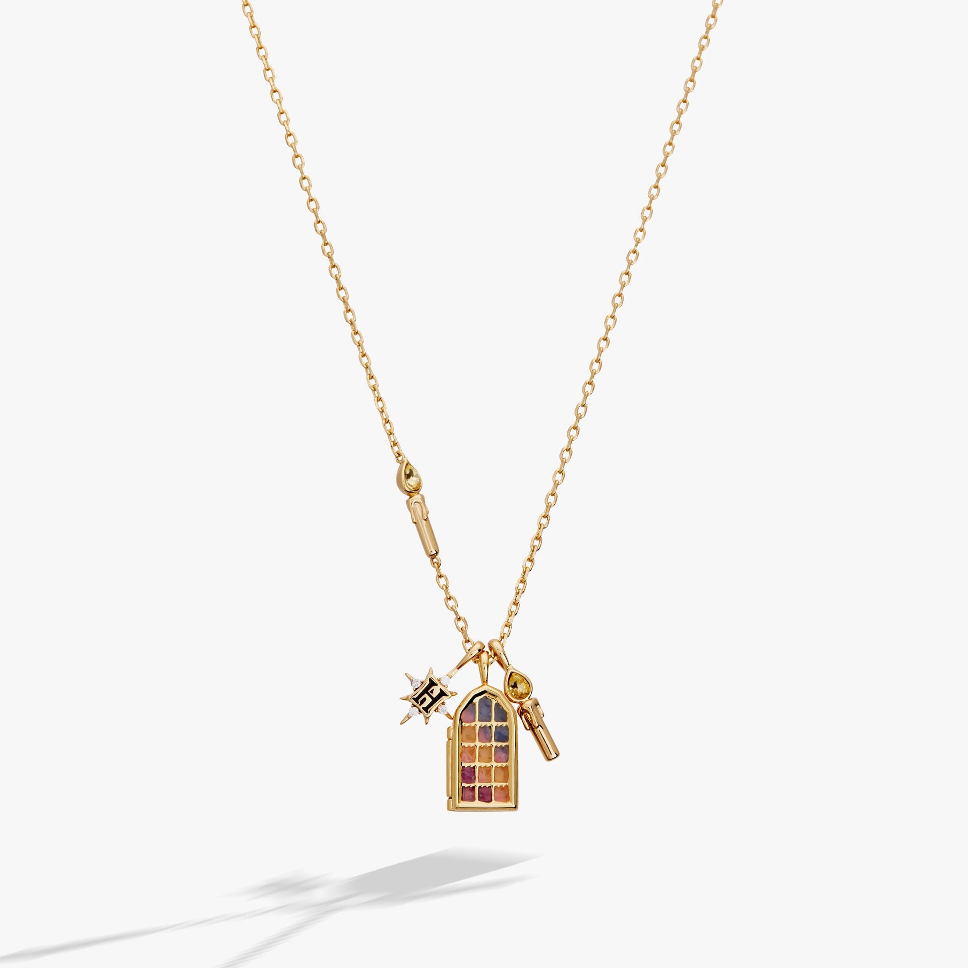 Gold-plated Harry Potter Hogwarts Great Hall charm necklace with stained glass enamel detail.