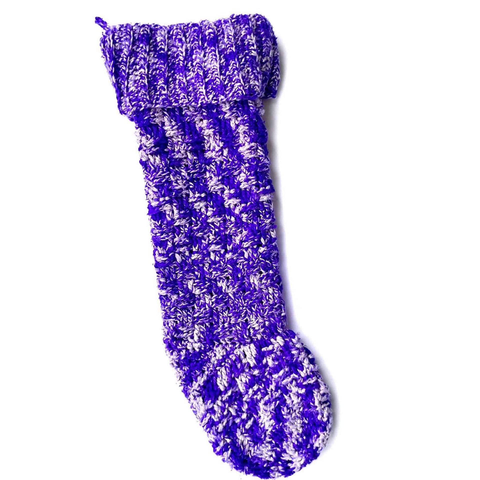 Handmade multi-colored purple and white knit Christmas stocking from the Holly Jolly Crochet Kit