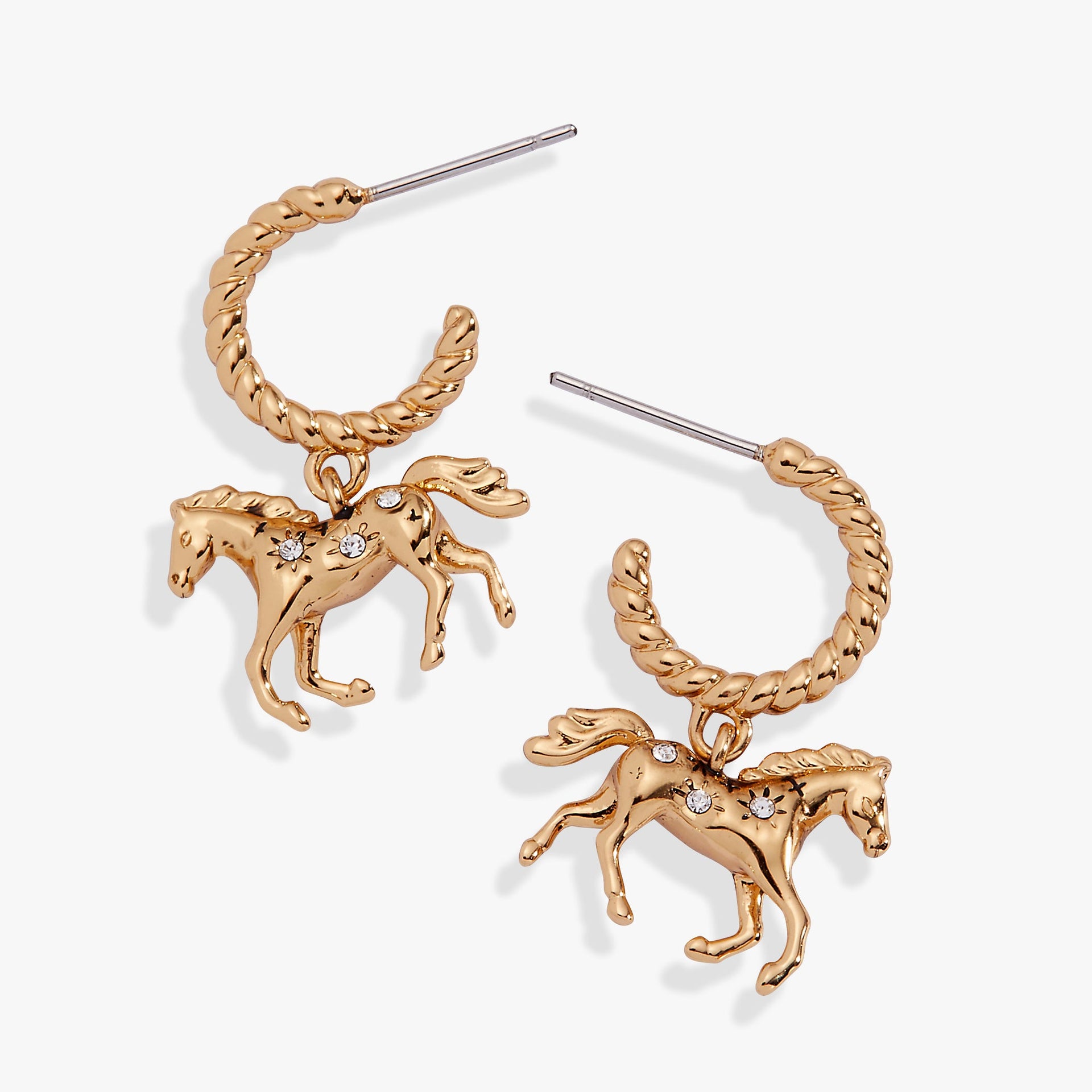 Gold-plated huggie hoop earrings with a dimensional horse design and faceted clear crystals.