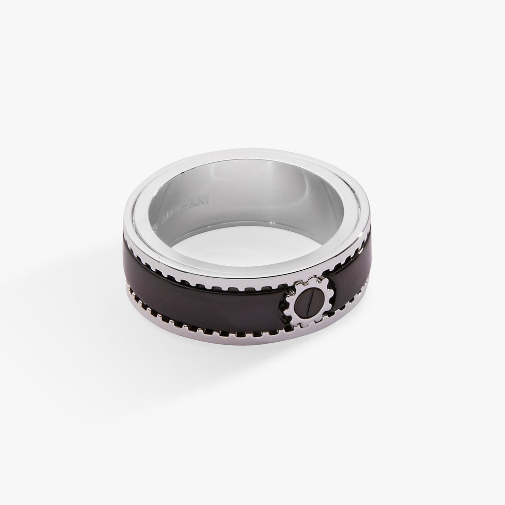 Close-up of a Hot Wheels branded stainless-steel fidget spinner ring in silver and black on a person's hand